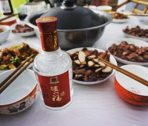 A bottle of Luzhou Lao Jiao as part of a Sichuan feast